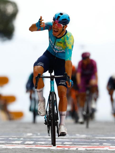 XDS Astana Team Italian rider Davide Ballerini celebrates as he crosses the finish line to win in the 6th stage of the Giro d'Italia 2026 - Tour of Italy cycling race between Paestum and Naples, southern Italy on May 14, 2026. (Photo by Luca Bettini / AFP)
