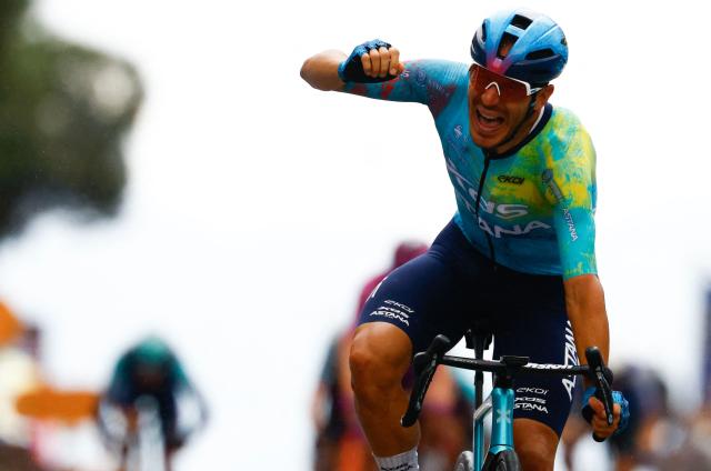 TOPSHOT - XDS Astana Team Italian rider Davide Ballerini celebrates as he crosses the finish line to win in the 6th stage of the Giro d'Italia 2026 - Tour of Italy cycling race between Paestum and Naples, southern Italy on May 14, 2026. (Photo by Luca Bettini / AFP)