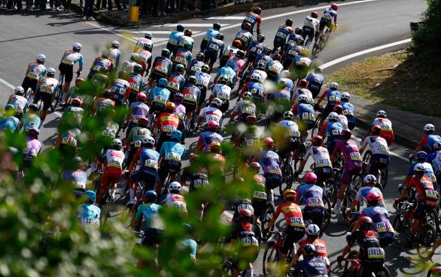 The pack rides during the 6th stage of the Giro d'Italia 2026 - Tour of Italy cycling race between Paestum and Naples, southern Italy on May 14, 2026. (Photo by Luca Bettini / AFP)