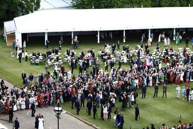 Britain's King Charles III talks to guests during a Royal Garden Party at Buckingham Palace, in London, on May 14, 2026, celebrating the 50th Anniversary of the King’s Trust.t. (Photo by Henry NICHOLLS / POOL / AFP)