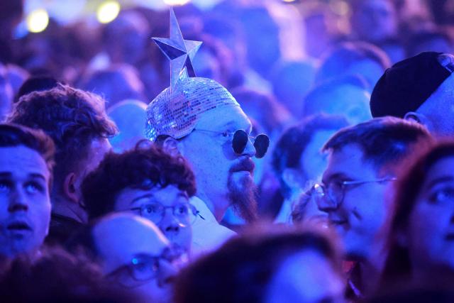 A fan looks on during a dress rehearsal for the second semi-final of the Eurovision Song Contest 2026 (ESC) in Vienna, Austria on May 14, 2026. (Photo by Radek MICA / AFP)