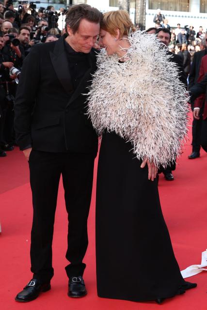 Polish cinematographer Lukasz Zal and German actress Sandra Huller arrive for the screening of the film "Fatherland" at the 79th edition of the Cannes Film Festival in Cannes, southern France on May 14, 2026. (Photo by Valery HACHE / AFP)
