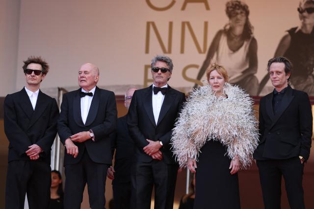 (From Top L) Polish cinematographer Lukasz Zal, German actor Hanns Zischler, Polish writer Pawel Pawlikowski, German actress Sandra Huller and German actor August Diehl arrive for the screening of the film "Fatherland" at the 79th edition of the Cannes Film Festival in Cannes, southern France on May 14, 2026. (Photo by Sameer AL-DOUMY / AFP)
