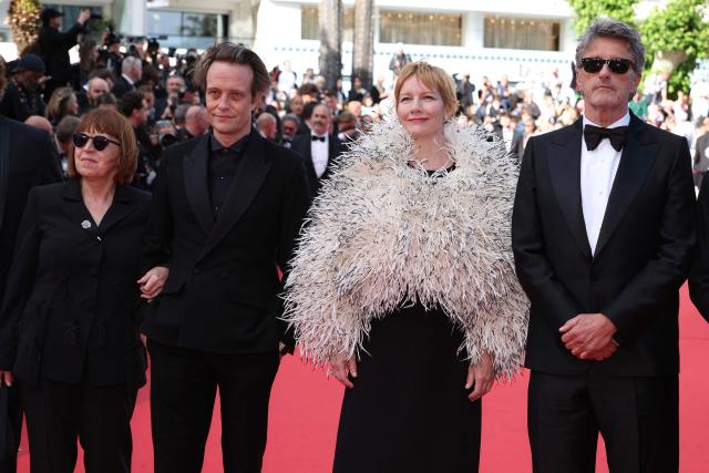 (From L) Polish producer Ewa Puszczynska, German actor August Diehl, German actress Sandra Hueller and Polish writer Pawel Pawlikowski arrive for the screening of the film "Fatherland" at the 79th edition of the Cannes Film Festival in Cannes, southern France on May 14, 2026. (Photo by Valery HACHE / AFP)
