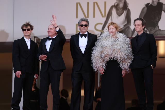 (From Top L) Polish cinematographer Lukasz Zal, German actor Hanns Zischler, Polish writer Pawel Pawlikowski, German actress Sandra Huller and German actor August Diehl arrive for the screening of the film "Fatherland" at the 79th edition of the Cannes Film Festival in Cannes, southern France on May 14, 2026. (Photo by Sameer AL-DOUMY / AFP)