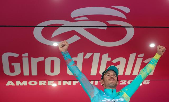 XDS Astana Team Italian rider Davide Ballerini celebrates on the podium after winning the 6th stage of the Giro d'Italia 2026 - Tour of Italy cycling race between Paestum and Naples, southern Italy on May 14, 2026. (Photo by Luca Bettini / AFP)