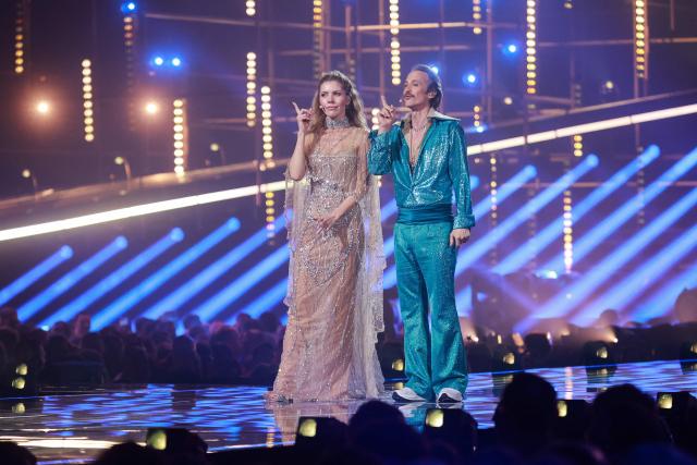 Austrian presenters Victoria Swarovski (L) and Michael Ostrowski stand on stage during a dress rehearsal for the second semi-final of the Eurovision Song Contest 2026 (ESC) in Vienna, Austria on May 14, 2026. (Photo by Radek MICA / AFP)