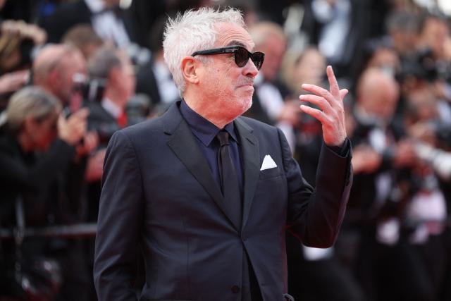 Mexican director Alfonso Cuaron arrives for the screening of the film "Fatherland" at the 79th edition of the Cannes Film Festival in Cannes, southern France on May 14, 2026. (Photo by Valery HACHE / AFP)