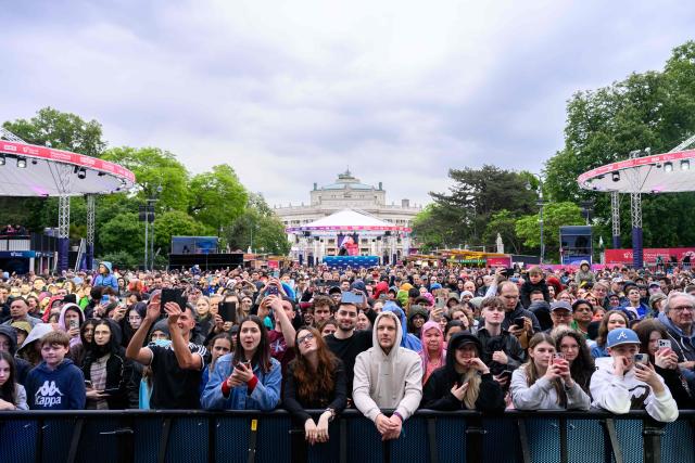 Spectators gather at the fan area in front of the City Hall in Vienna on May 14, 2026, prior to the second semi-final of the Eurovision Song Contest (ESC). (Photo by MAX SLOVENCIK / APA / AFP) / Austria OUT