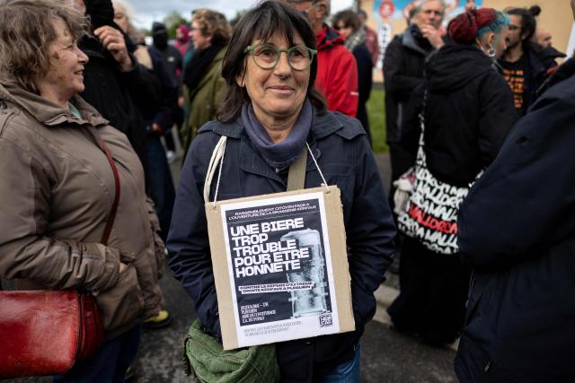 People protest during the opening of a brewery by journalist and far-right activist Erik Tegner in Pleguien, western France on May 14, 2026. Tegner, a commentator on CNews television and co-founder of the far-right outlet Frontières, opened the Kerfave craft brewery alongside a business partner in the Cotes-d'Armor department, with anti-fascist groups mobilising against the launch. (Photo by Fred TANNEAU / AFP)