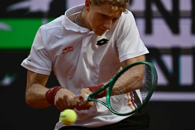 Spain's Martin Landaluce hits a return to Russia's Daniil Medvedev during the ATP Rome Open tennis tournament at Foro Italico in Rome on May 14, 2026. (Photo by Filippo MONTEFORTE / AFP)
