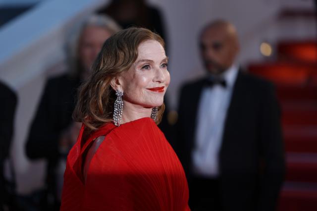 French actress Isabelle Huppert arrives for the screening of the film "Histoires Paralleles" (Parallel Tales) at the 79th edition of the Cannes Film Festival in Cannes, southern France on May 14, 2026. (Photo by Sameer AL-DOUMY / AFP)