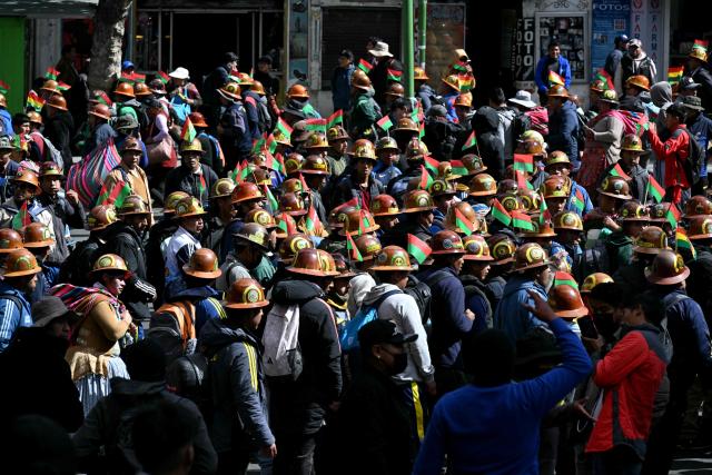 Miners march to demand the resignation of Bolivian President Rodrigo Paz in La Paz, on May 14, 2026. For the past two weeks, workers, farmers, school teachers, Indigenous groups and transport workers have been pressuring the government. Their demands range from wage increases and economic stabilization to opposition to the privatization of public companies. (Photo by AIZAR RALDES / AFP)