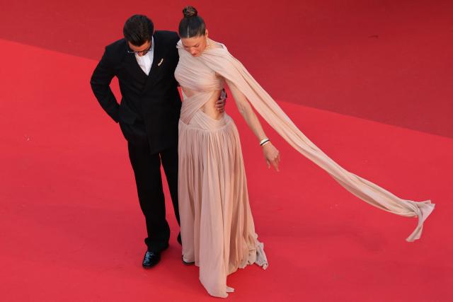 French actor Pierre Niney and his wife Australian actress Natasha Andrews arrive for the screening of the film "Histoires Paralleles" (Parallel Tales) at the 79th edition of the Cannes Film Festival in Cannes, southern France on May 14, 2026. (Photo by Thibaud MORITZ / AFP)
