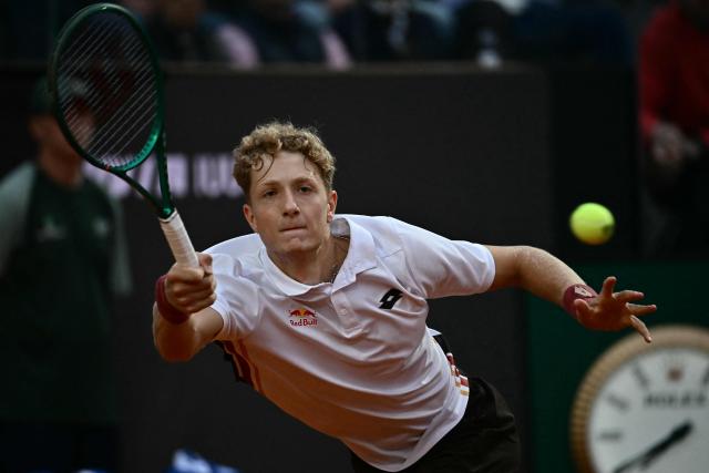 Spain's Martin Landaluce hits a return to Russia's Daniil Medvedev during the ATP Rome Open tennis tournament at Foro Italico in Rome on May 14, 2026. (Photo by Filippo MONTEFORTE / AFP)