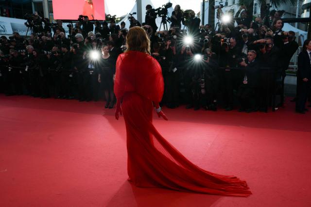 French actress Isabelle Huppert arrives for the screening of the film "Histoires Paralleles" (Parallel Tales) at the 79th edition of the Cannes Film Festival in Cannes, southern France on May 14, 2026. (Photo by Olivier CHASSIGNOLE / AFP)