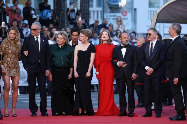 (From L) Belgian-French actress Virginie Efira, French actor Vincent Cassel, French actress Catherine Deneuve, French actor Adam Bessa, French actress India Hair, French actress Isabelle Huppert, Iranian director Asghar Farhadi and French producer Alexandre Mallet-Guy arrive for the screening of the film "Histoires Paralleles" (Parallel Tales) at the 79th edition of the Cannes Film Festival in Cannes, southern France on May 14, 2026. (Photo by Sameer AL-DOUMY / AFP)