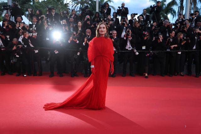 French actress Isabelle Huppert arrives for the screening of the film "Histoires Paralleles" (Parallel Tales) at the 79th edition of the Cannes Film Festival in Cannes, southern France on May 14, 2026. (Photo by Sameer AL-DOUMY / AFP)