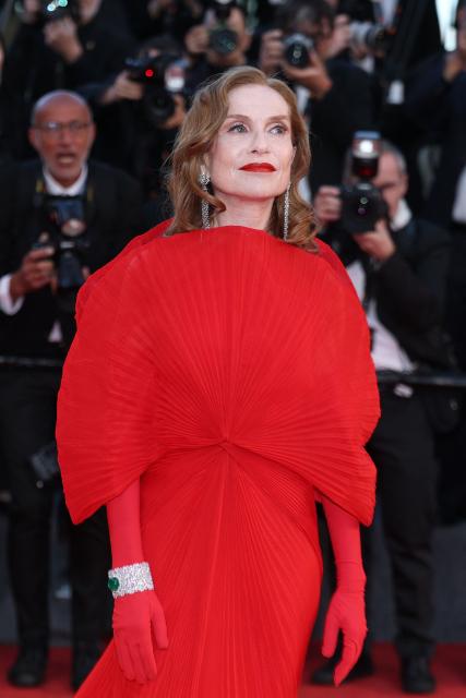 French actress Isabelle Huppert arrives for the screening of the film "Histoires Paralleles" (Parallel Tales) at the 79th edition of the Cannes Film Festival in Cannes, southern France on May 14, 2026. (Photo by Sameer AL-DOUMY / AFP)