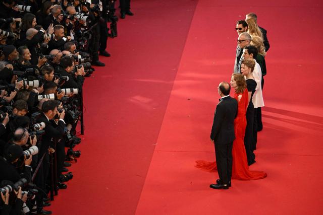 The cast arrive for the screening of the film "Histoires Paralleles" (Parallel Tales) at the 79th edition of the Cannes Film Festival in Cannes, southern France on May 14, 2026. (Photo by Antonin THUILLIER / AFP)