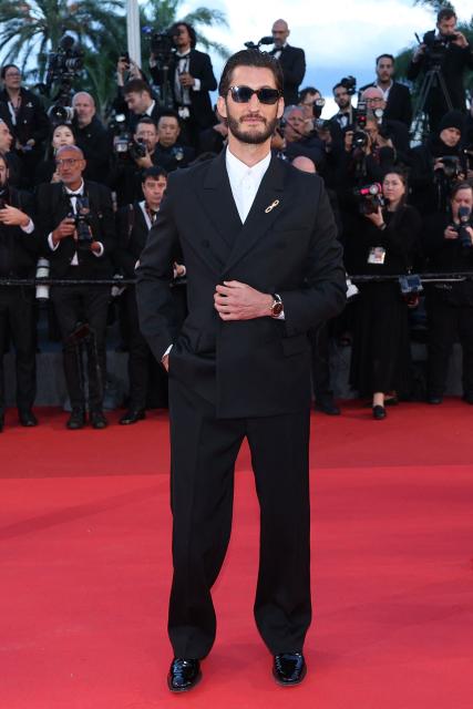 French actor Pierre Niney arrives for the screening of the film "Histoires Paralleles" (Parallel Tales) at the 79th edition of the Cannes Film Festival in Cannes, southern France on May 14, 2026. (Photo by Sameer AL-DOUMY / AFP)