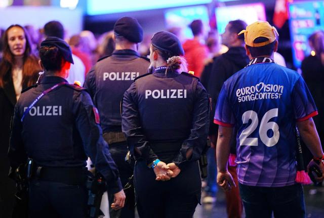 Police officers are seen prior to the start of the second semi-final of the Eurovision Song Contest 2026 (ESC) at the Wiener Stadthalle in Vienna, Austria on May 14, 2026. (Photo by GEORG HOCHMUTH / APA / AFP) / Austria OUT