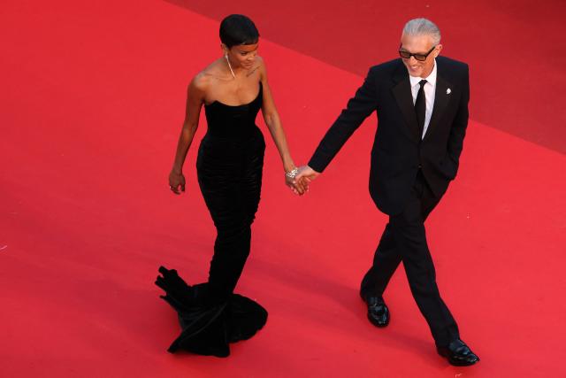 French actor Vincent Cassel and his partner Brazilian model Narah Baptista arrive for the screening of the film "Histoires Paralleles" (Parallel Tales) at the 79th edition of the Cannes Film Festival in Cannes, southern France on May 14, 2026. (Photo by Thibaud MORITZ / AFP)