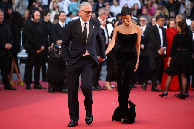 French actor Vincent Cassel and his partner Brazilian model Narah Baptista arrive for the screening of the film "Histoires Paralleles" (Parallel Tales) at the 79th edition of the Cannes Film Festival in Cannes, southern France on May 14, 2026. (Photo by Valery HACHE / AFP)