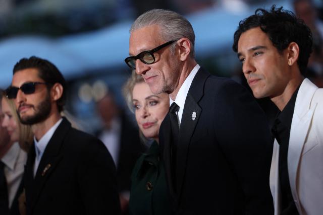 (From L) French actor Pierre Niney, French actress Catherine Deneuve, French actor Vincent Cassel and French actor Adam Bessa arrive for the screening of the film "Histoires Paralleles" (Parallel Tales) at the 79th edition of the Cannes Film Festival in Cannes, southern France on May 14, 2026. (Photo by Sameer AL-DOUMY / AFP)