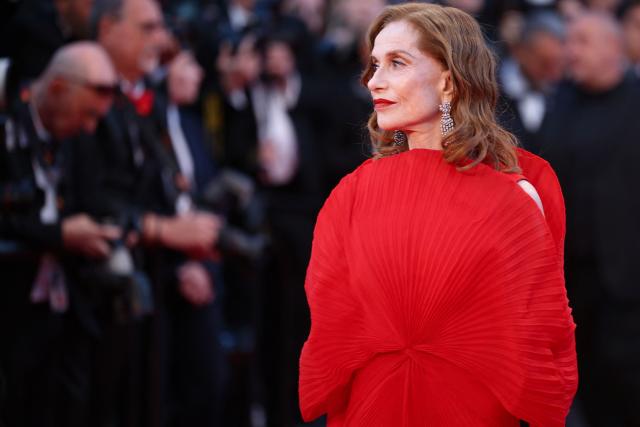 French actress Isabelle Huppert arrives for the screening of the film "Histoires Paralleles" (Parallel Tales) at the 79th edition of the Cannes Film Festival in Cannes, southern France on May 14, 2026. (Photo by Valery HACHE / AFP)