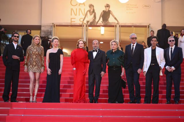 (From L) French actor Pierre Niney, Belgian actress Virginie Efira, French actress India Hair, French actress Isabelle Huppert, Iranian director Asghar Farhadi, French actress Catherine Deneuve, French actor Vincent Cassel, French actor Adam Bessa and French producer Alexandre Mallet-Guy arrive for the screening of the film "Histoires Paralleles" (Parallel Tales) at the 79th edition of the Cannes Film Festival in Cannes, southern France on May 14, 2026. (Photo by Valery HACHE / AFP)
