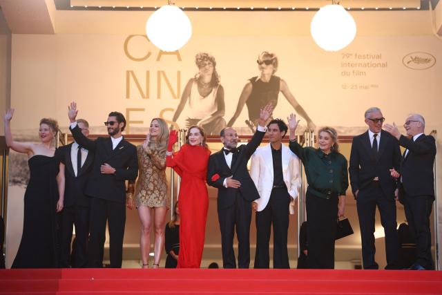 (From L) French actress India Hair, French actor Pierre Niney, Belgian actress Virginie Efira, French actress Isabelle Huppert, Iranian director Asghar Farhadi, French actor Adam Bessa, French actress Catherine Deneuve, French actor Vincent Cassel and Cannes film festival director Thierry Fremaux arrive for the screening of the film "Histoires Paralleles" (Parallel Tales) at the 79th edition of the Cannes Film Festival in Cannes, southern France on May 14, 2026. (Photo by Valery HACHE / AFP)