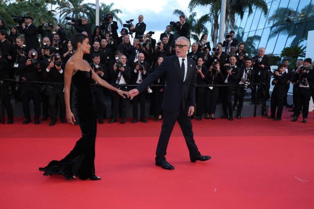 French actor Vincent Cassel and his partner Brazilian model Narah Baptista arrive for the screening of the film "Histoires Paralleles" (Parallel Tales) at the 79th edition of the Cannes Film Festival in Cannes, southern France on May 14, 2026. (Photo by Sameer AL-DOUMY / AFP)