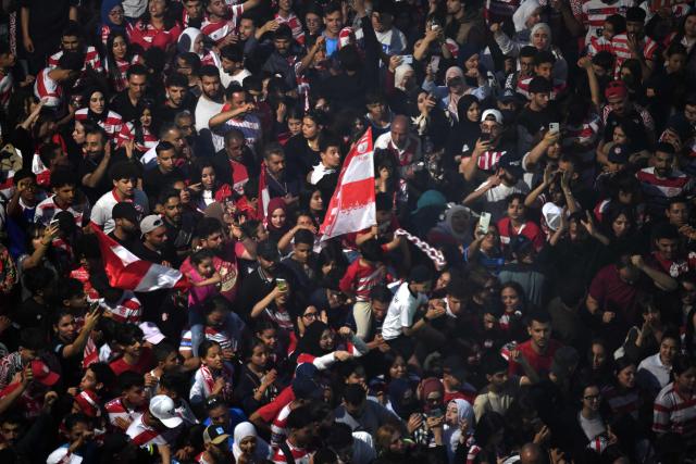 Fans celebrate during the victory ceremony of the Club Africain football team in the 2025/2026 Tunisian Ligue 1 championship, in Tunis on May 14, 2026. (Photo by FETHI BELAID / AFP)