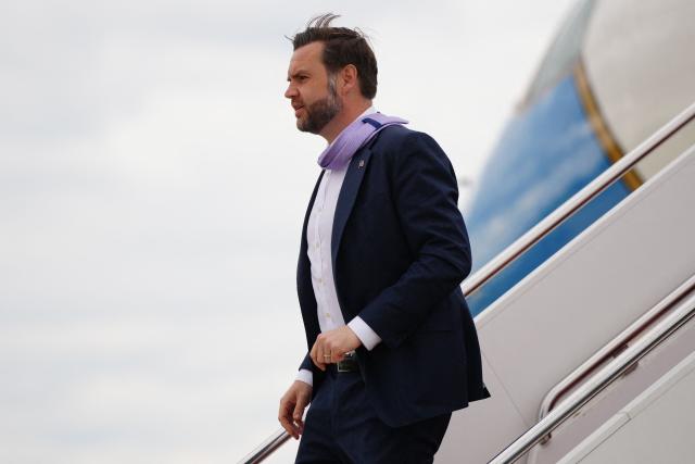 Vice President JD Vance disembarks Air Force Two at Joint Base Andrews, Maryland on May 14, 2026. Vance traveled to Bangor, Maine to give remarks on the Trump administration's efforts to combat fraud. (Photo by Tierney L CROSS / POOL / AFP)