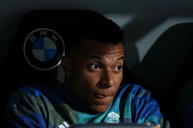 Real Madrid's French forward #10 Kylian Mbappe is pictured in the bench before the Spanish league football match between Real Madrid CF and Real Oviedo at Santiago Bernabeu Stadium in Madrid on May 14, 2026. (Photo by Oscar DEL POZO / AFP)