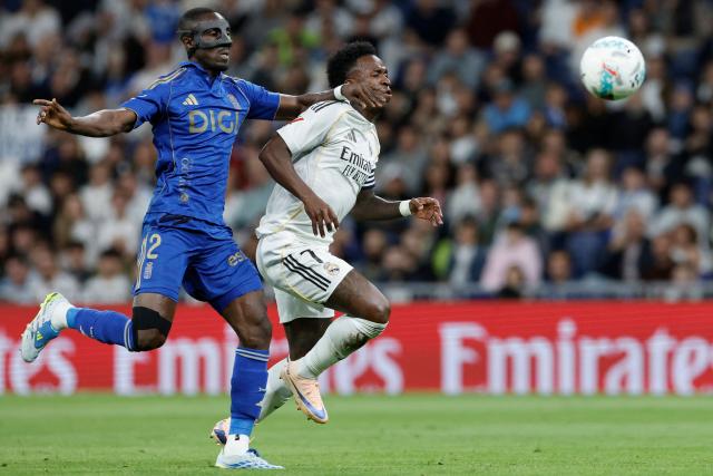 Real Oviedo's Ivorian defender #02 Eric Bailly and Real Madrid's Brazilian forward #07 Vinicius Junior fight for the ball during the Spanish league football match between Real Madrid CF and Real Oviedo at Santiago Bernabeu Stadium in Madrid on May 14, 2026. (Photo by Oscar DEL POZO / AFP)