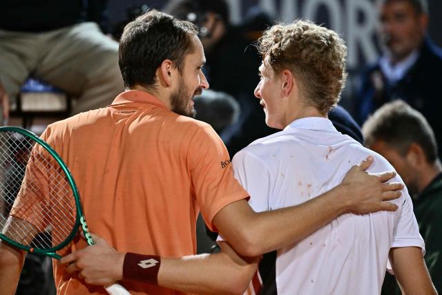 Russia's Daniil Medvedev and Spain's Martin Landaluce congratulate each other at the end of their match during the ATP Rome Open tennis tournament at Foro Italico in Rome on May 14, 2026. (Photo by Filippo MONTEFORTE / AFP)