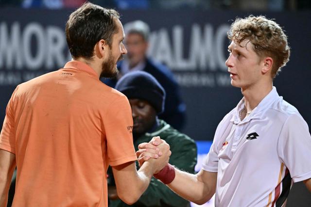 Russia's Daniil Medvedev and Spain's Martin Landaluce congratulate each other at the end of their match during the ATP Rome Open tennis tournament at Foro Italico in Rome on May 14, 2026. (Photo by Filippo MONTEFORTE / AFP)
