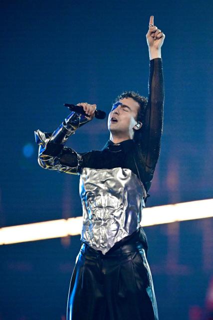 Austrian singer Benjamin Gedeon, aka Cosmo and representing Austria with the song 'Tanzschein', performs during the second semi-final of the Eurovision Song Contest 2026 (ESC) at Wiener Stadthalle in Vienna, Austria on May 14, 2026. (Photo by Tobias SCHWARZ / AFP)