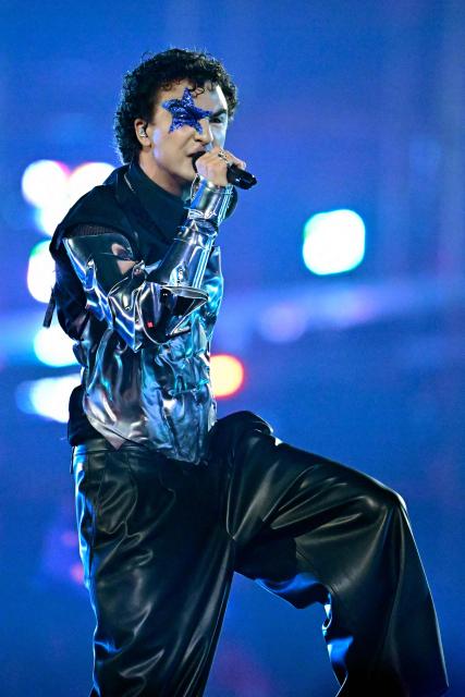 Austrian singer Benjamin Gedeon, aka Cosmo and representing Austria with the song 'Tanzschein', performs during the second semi-final of the Eurovision Song Contest 2026 (ESC) at Wiener Stadthalle in Vienna, Austria on May 14, 2026. (Photo by Tobias SCHWARZ / AFP)
