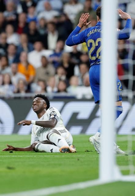 Real Madrid's Brazilian forward #07 Vinicius Junior reacts to missing a goal opportunity during the Spanish league football match between Real Madrid CF and Real Oviedo at Santiago Bernabeu Stadium in Madrid on May 14, 2026. (Photo by Oscar DEL POZO / AFP)