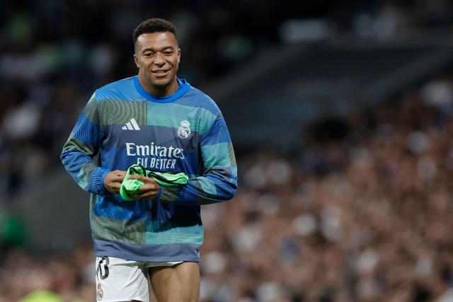 Real Madrid's French forward #10 Kylian Mbappe warms up during the Spanish league football match between Real Madrid CF and Real Oviedo at Santiago Bernabeu Stadium in Madrid on May 14, 2026. (Photo by Oscar DEL POZO / AFP)