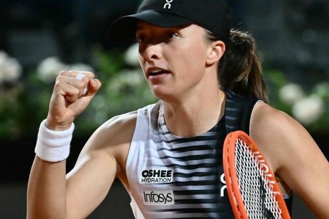 Poland's Iga Swiatek celebrates a point against Ukraine's Elina Svitolina during the WTA Rome Open tennis tournament at Foro Italico in Rome on May 14, 2026. (Photo by Filippo MONTEFORTE / AFP)