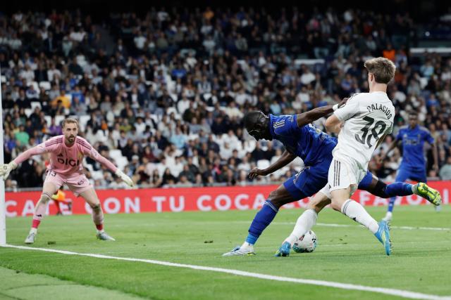 Real Oviedo's Ivorian defender #02 Eric Bailly and Real Madrid's Spanish midfielder #38 Cesar Palacios fight for the ball during the Spanish league football match between Real Madrid CF and Real Oviedo at Santiago Bernabeu Stadium in Madrid on May 14, 2026. (Photo by Oscar DEL POZO / AFP)
