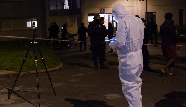 This video screen grab shows forensic police officers at the scene of a shooting in Nantes, France, on May 14, 2026, where a 15-year-old was killed and two minors were injured. (Photo by AFP)