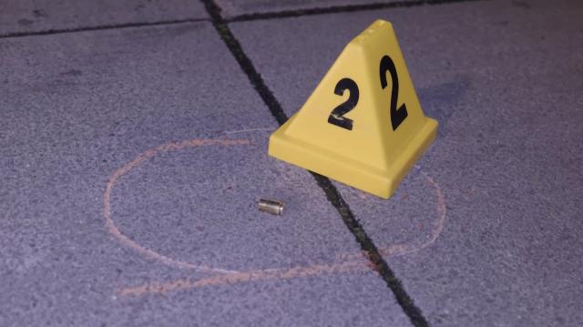 This video screen grab shows a spent shell casing on the ground at the scene of a shooting in Nantes, France, on May 14, 2026, where a 15-year-old was killed and two minors were injured. (Photo by AFP)