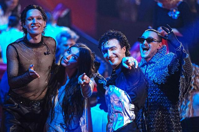 (LtoR) Denmark's Soeren Torpegaard Lund, Luxembourg's Eva Marija, Austria's Cosmo and Albania's Alis celebrate after the second semi-final of the Eurovision Song Contest 2026 (ESC) at Wiener Stadthalle in Vienna, Austria on May 14, 2026. (Photo by GEORG HOCHMUTH / APA / AFP) / Austria OUT