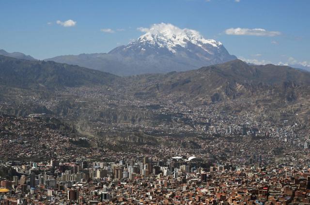 The snow-capped Illimani mountain is pictured in from La Paz on May 14, 2026. (Photo by Aizar RALDES / AFP)