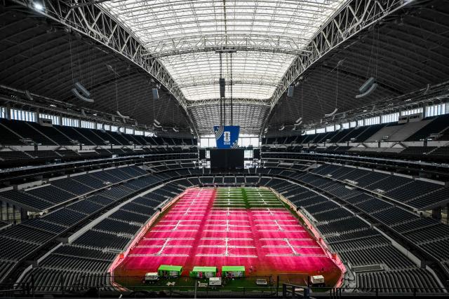 Dallas Stadium (temporarily renamed from AT&T Stadium for the 2026 FIFA World Cup) is seen with purple lights illuminating the field to promote grass growth, in Arlington, Texas, on May 14, 2026. (Photo by RONALDO SCHEMIDT / AFP)